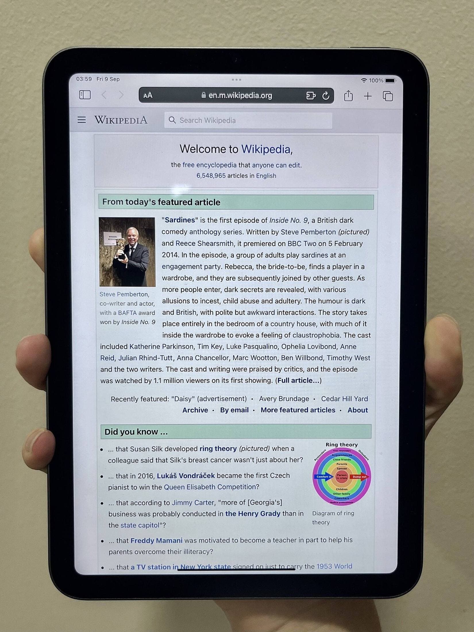 iPad mini held for one-hand use