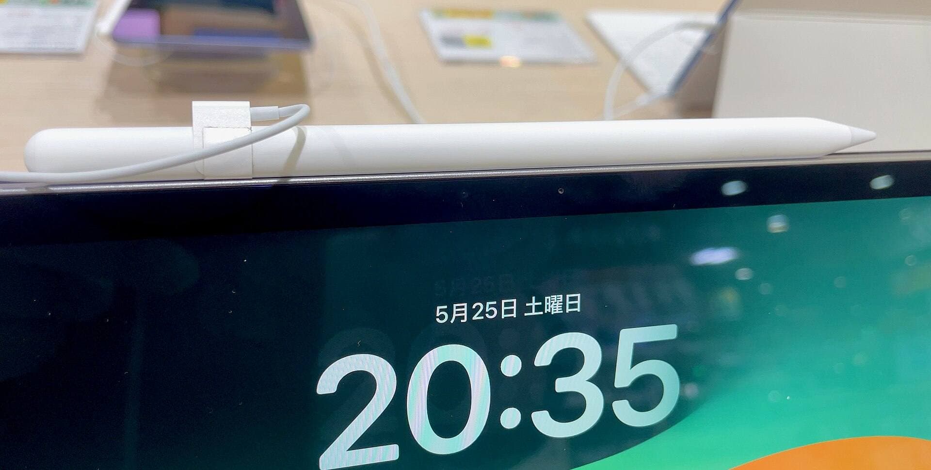 iPad with Apple Pencil in drawing position